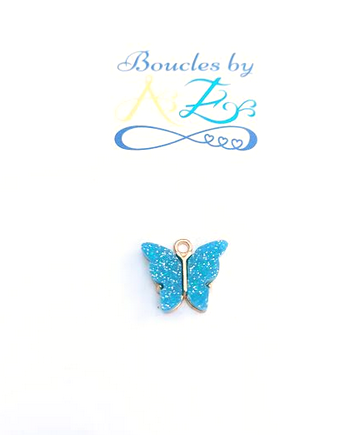 Breloque papillon turquoise 14x16mm.